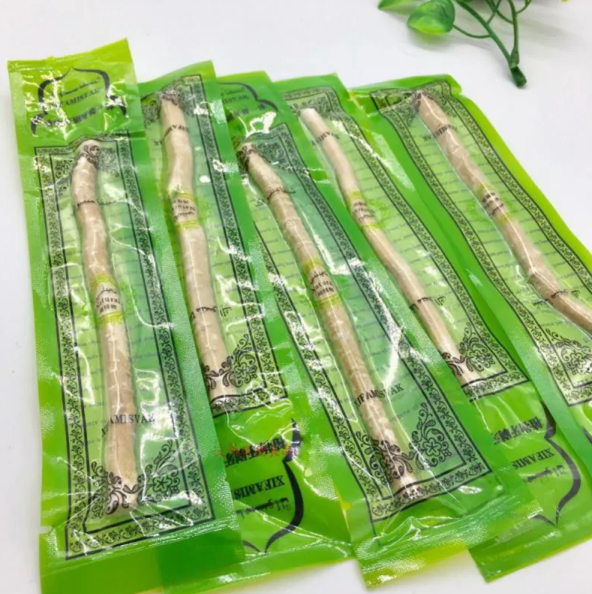 Miswak Tooth Cleaning Stick in eco-friendly packaging, natural wooden bristles for effective oral care.