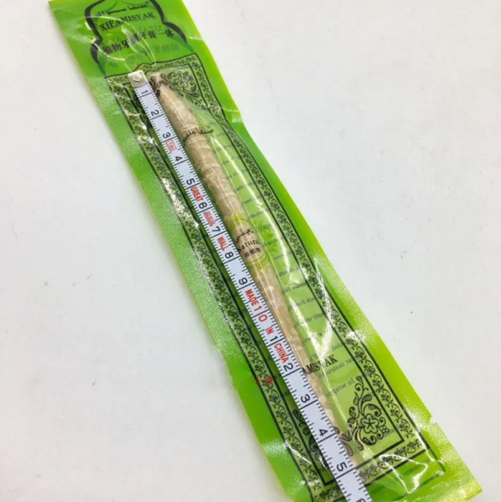 Miswak Tooth Cleaning Stick in packaging, traditional natural wood stick for oral care and teeth cleaning, 15cm length.