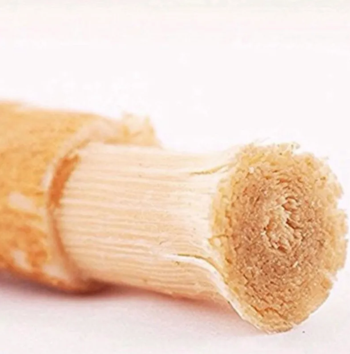 Close-up of a Miswak Tooth Cleaning Stick made from natural wood, ideal for oral care.